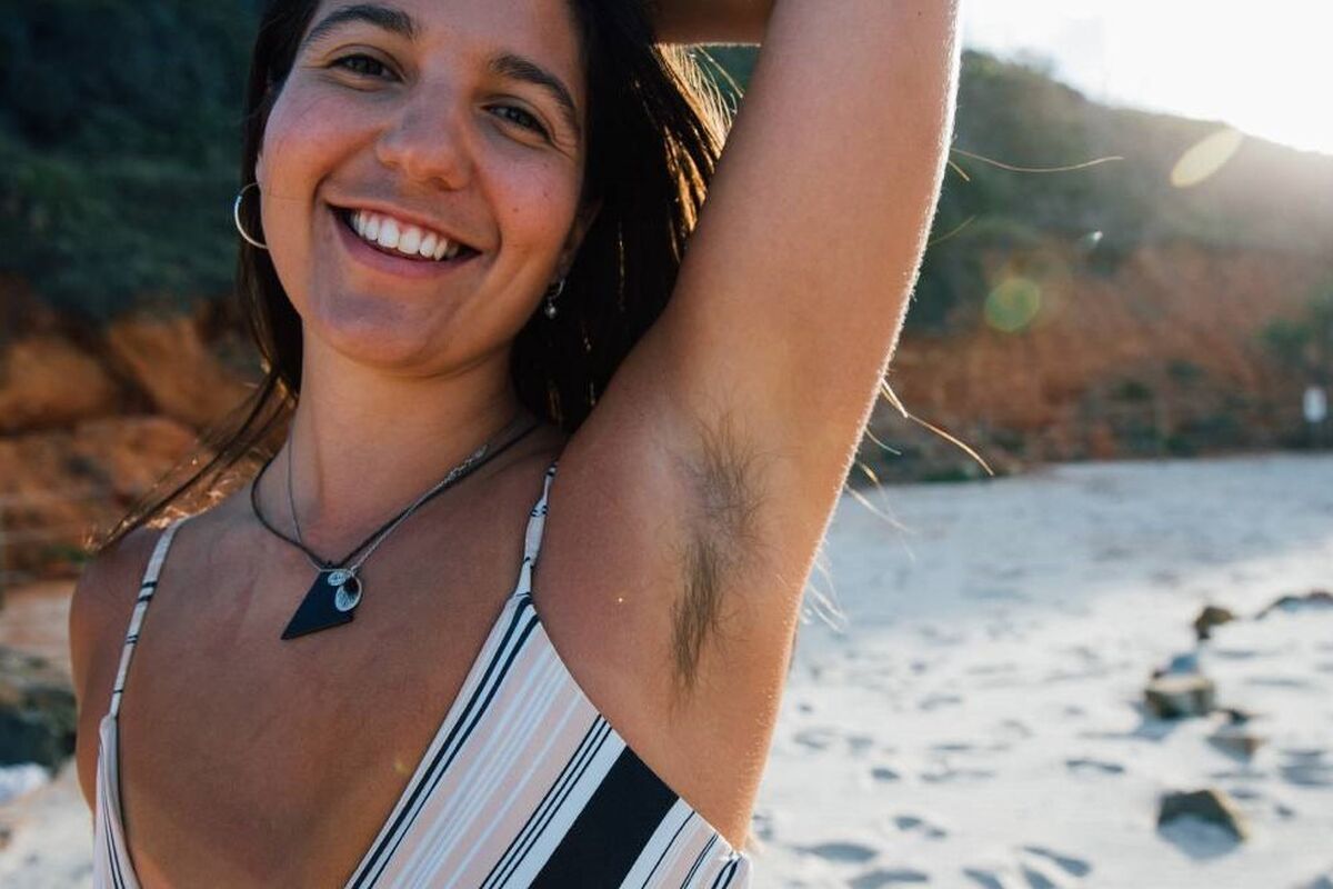 Young woman smiling at the beach