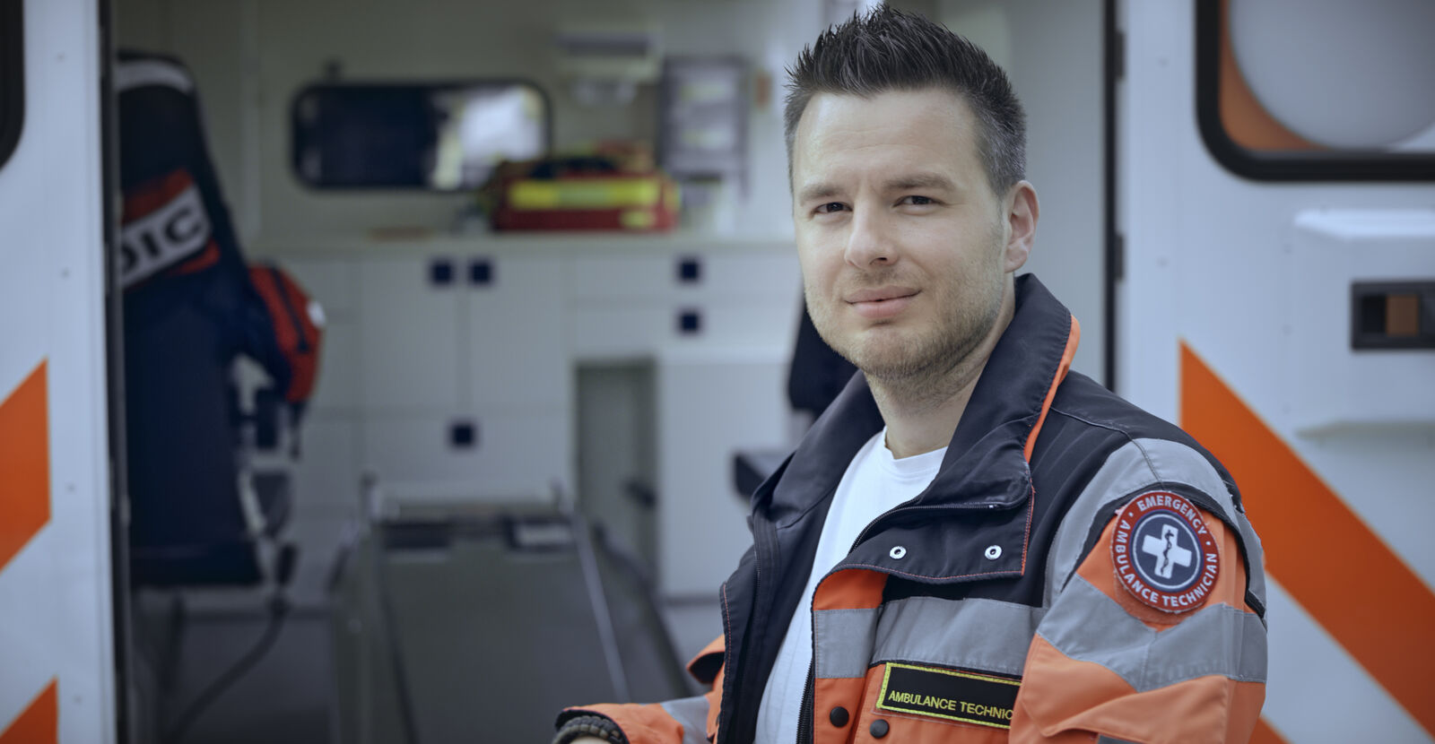 A man wearing a paramedic's uniform