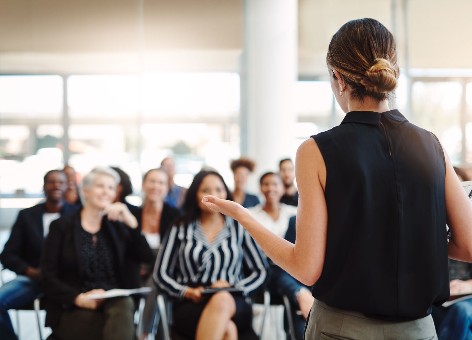 Woman teaching a classroom of adult students